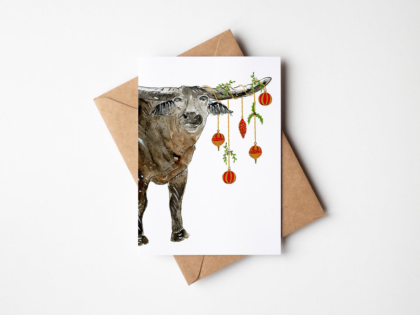 Christmas card with a buffalo and christmas baubles on a white Top End Christmas cards, Aussie Christmas cards, NT Christmas cards background