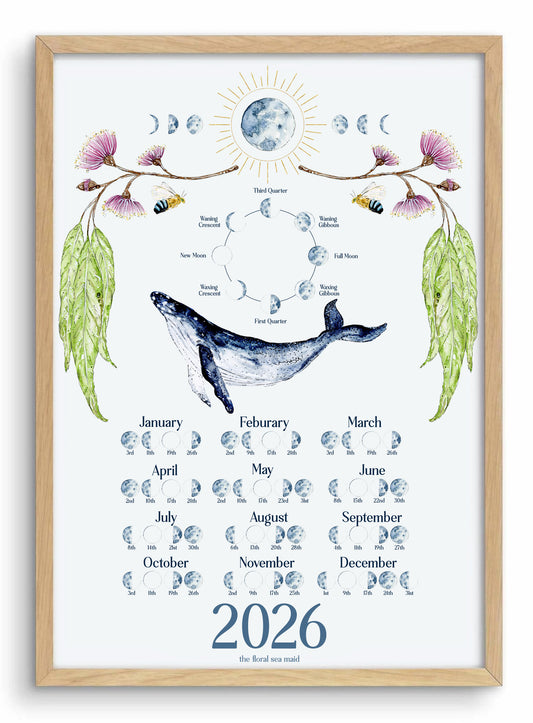 Framed artwork with a whale and moon phases for 2026, featuring a wooden frame. 2026 Lunar moon calendar